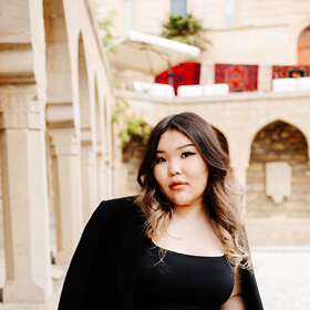 Woman standing in Icherisheher Old City Baku for woman only photo tour